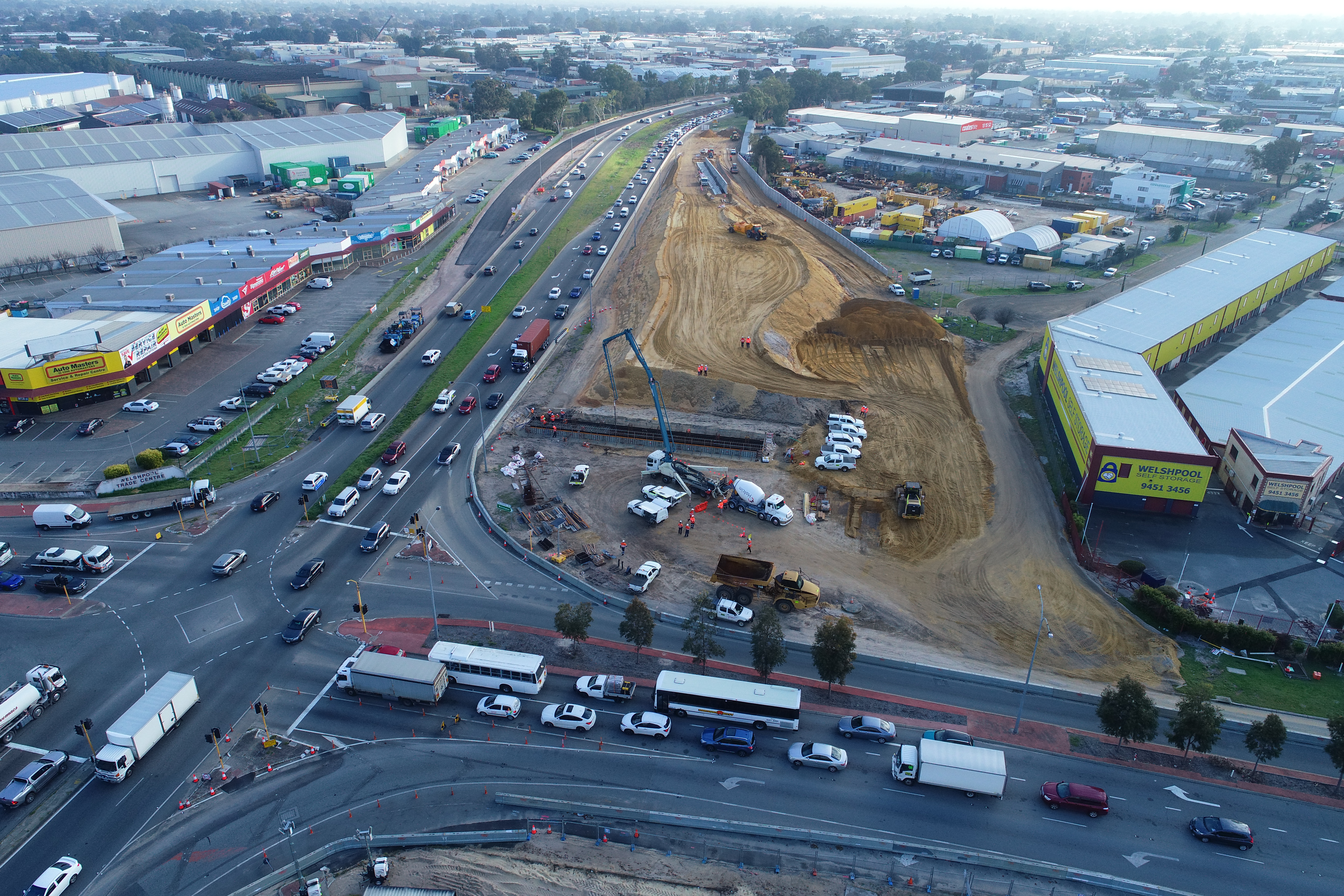 Aerial view of Leach Highway and Welshpool Road intersection with an area cleared for construction