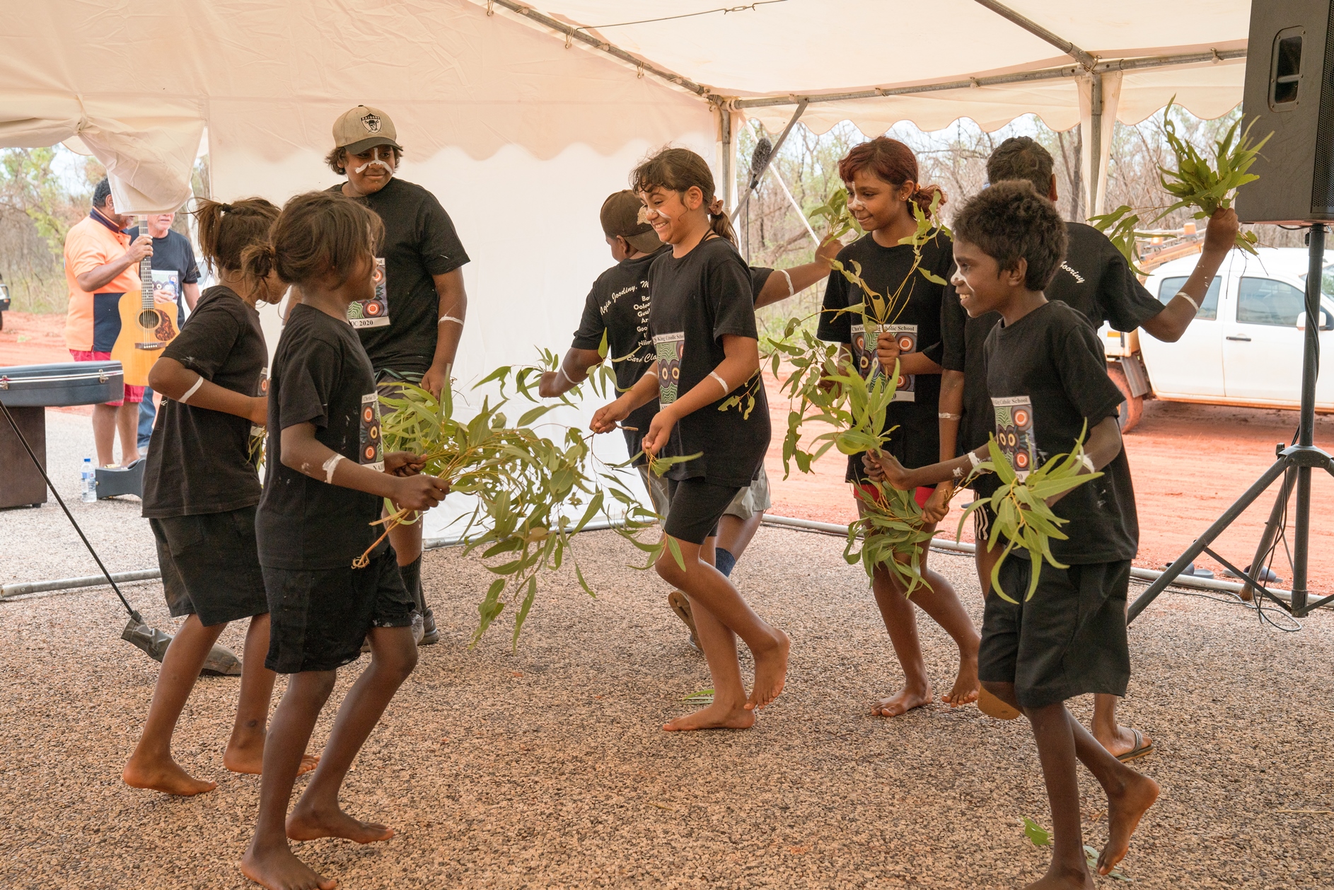 Children dancing at a project event