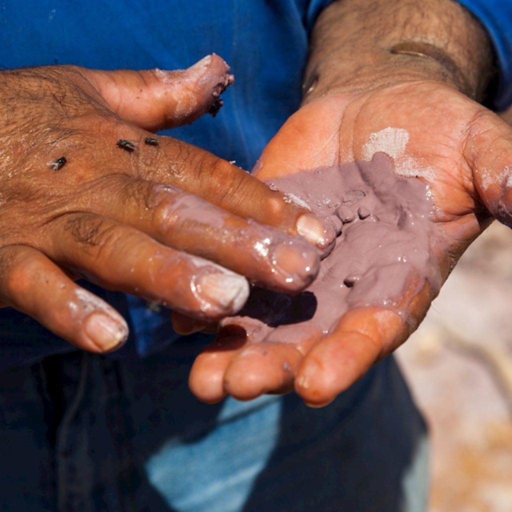 Mud in a person's hand