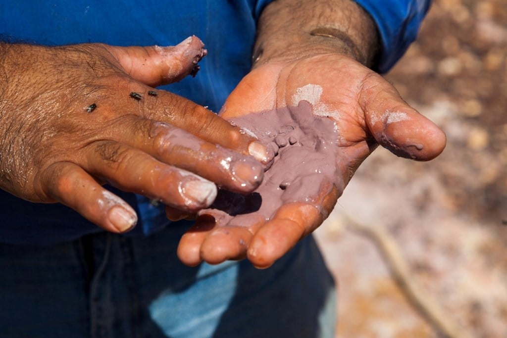 Mud in a person's hand