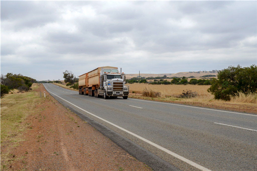 Truck driving along Geraldton Mt Magnet Road