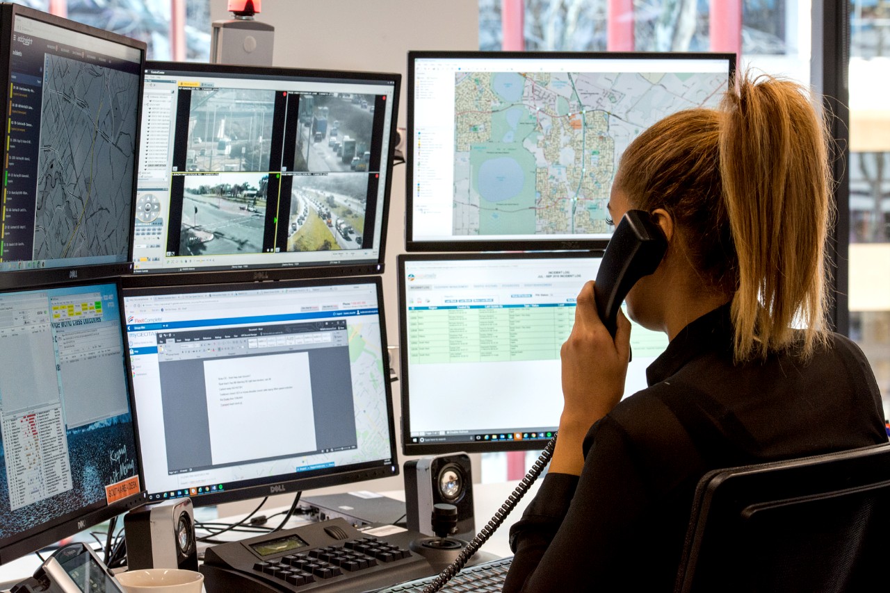 Woman on the phone in front of a computer
