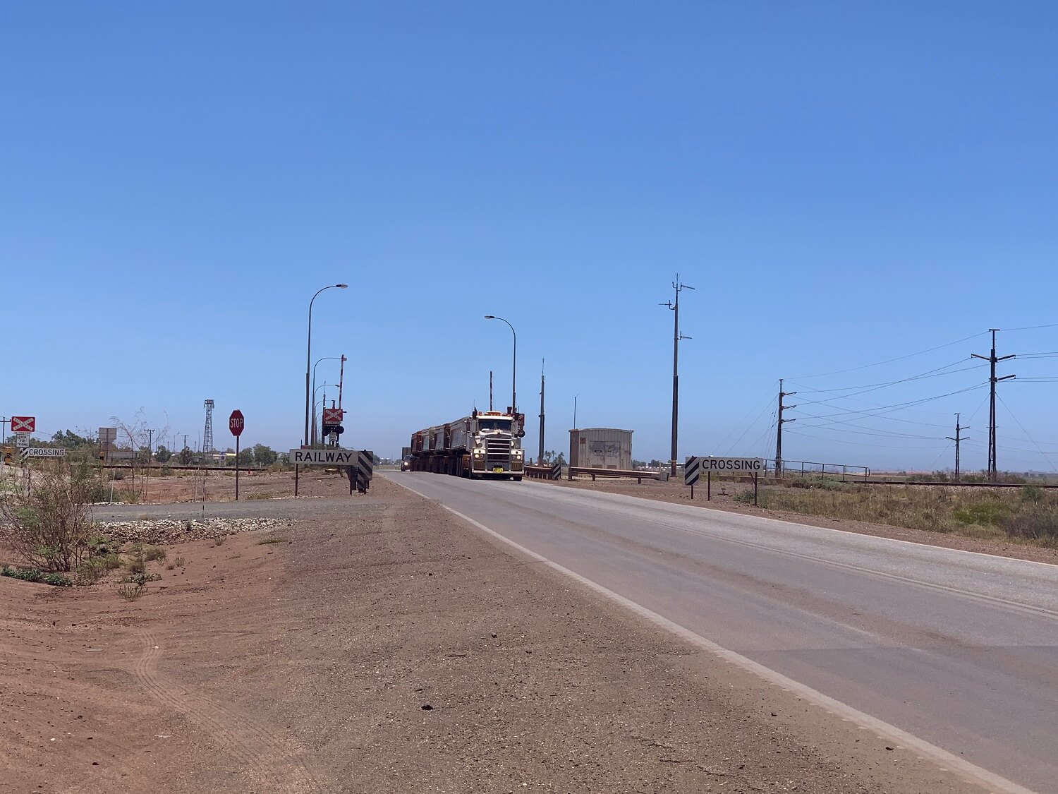 Truck driving over a rail crossing