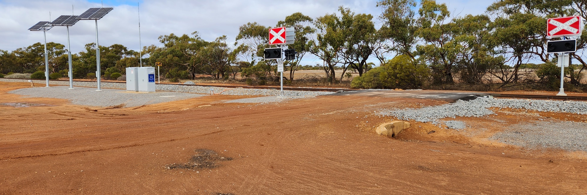 level crossing with flashing lights.