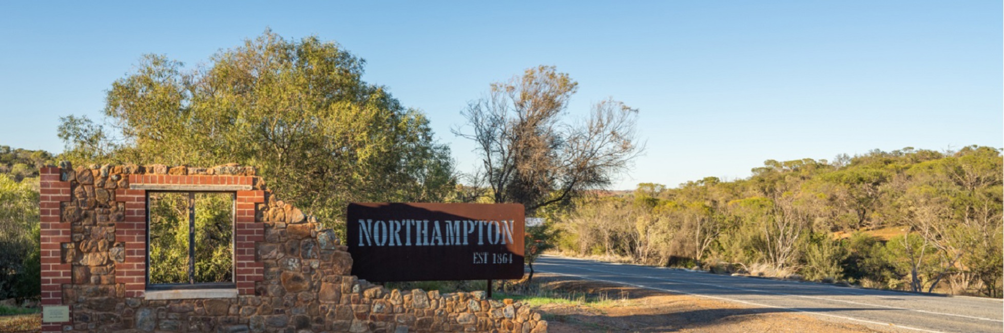 Sign for town of Northampton and road nearby
