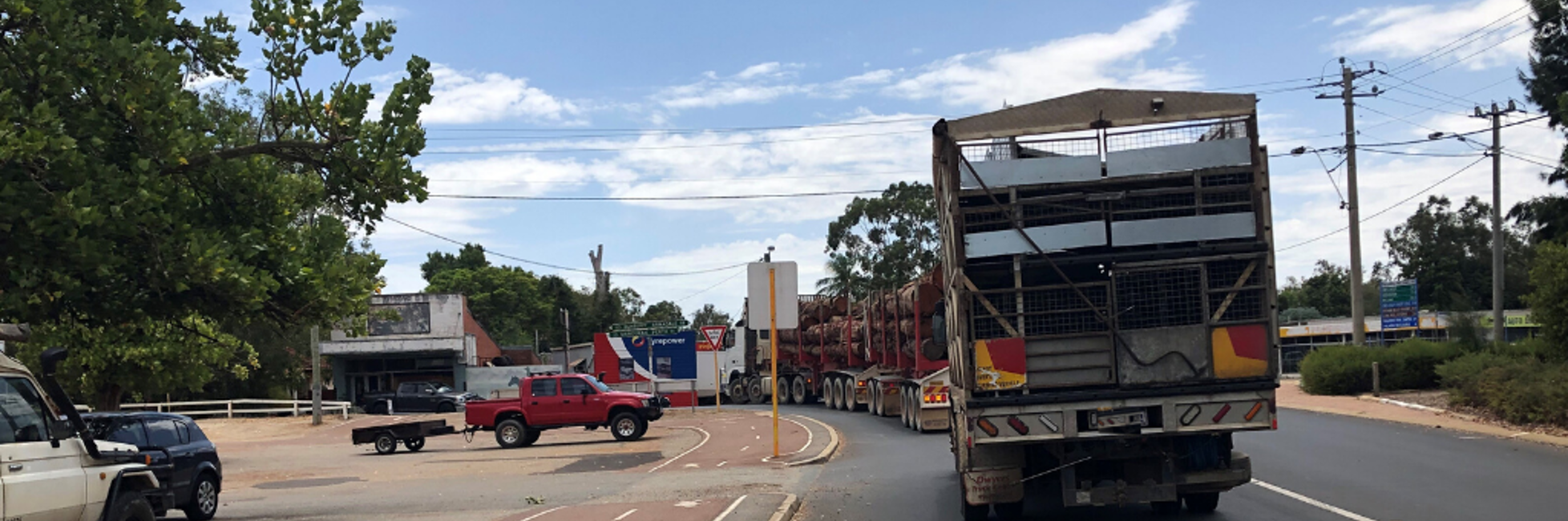 Large heavy vehicles travelling on a road