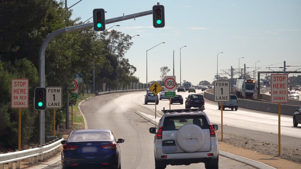 Vehicles stopped at the red signal on the Smart Freeway