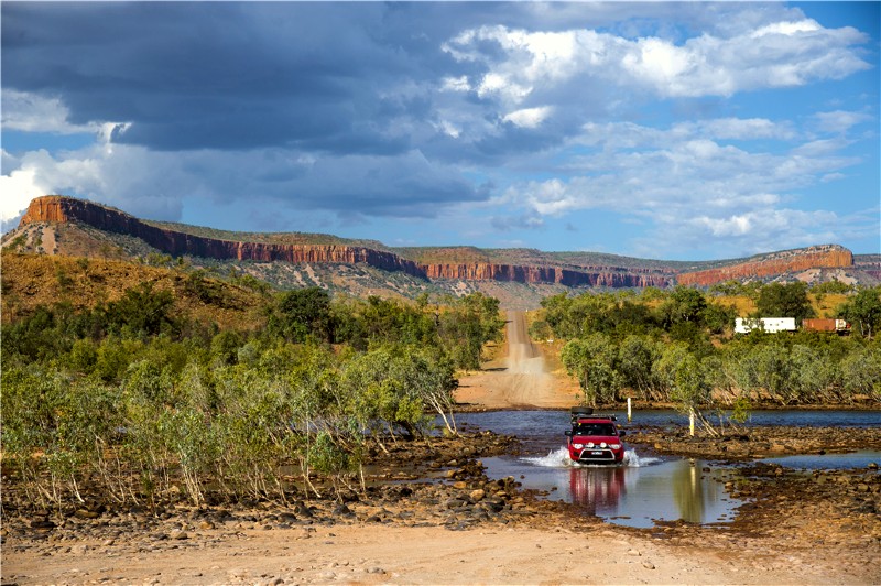 Car driving through water on the Gibb River Road