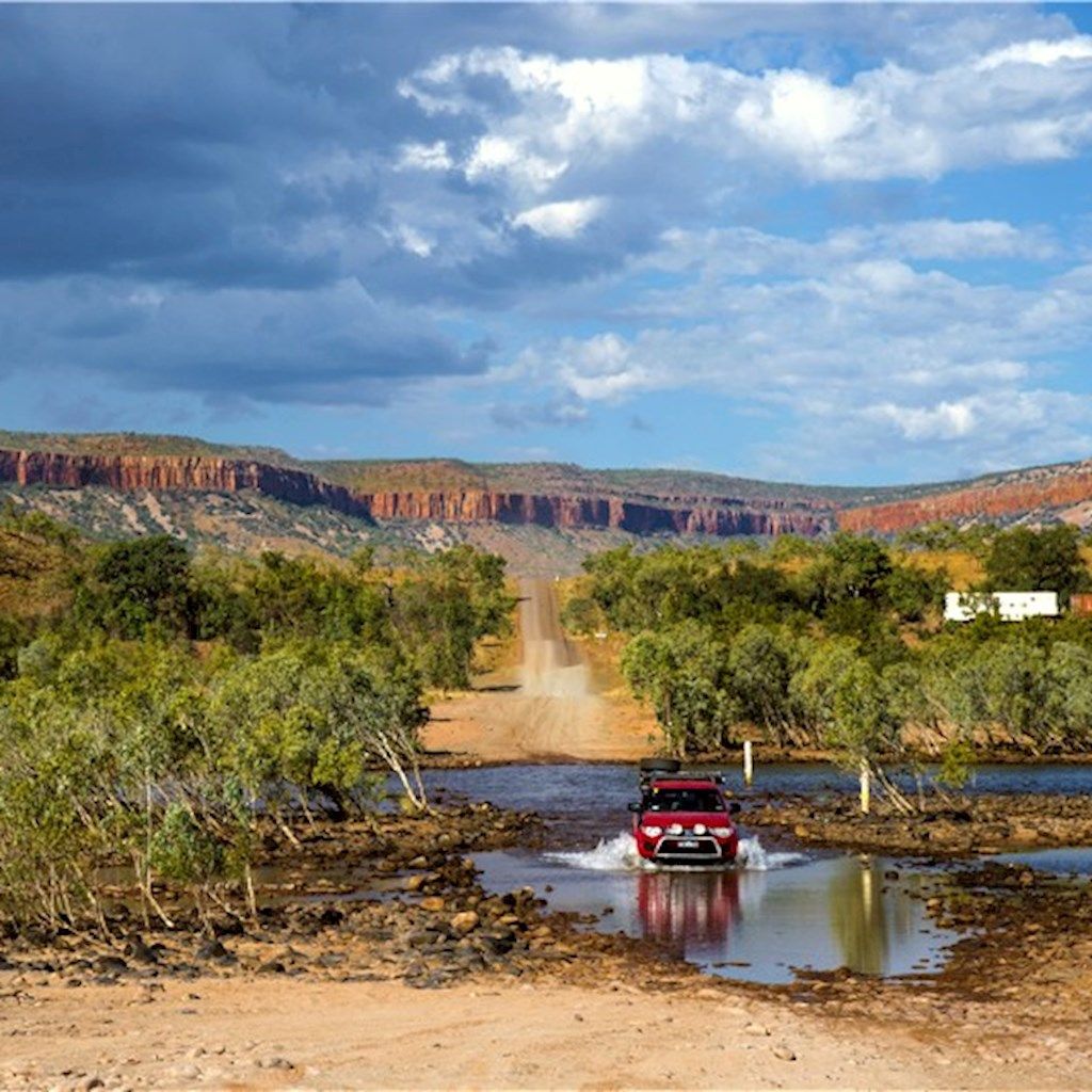 Car driving through water on the Gibb River Road