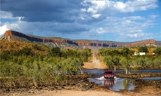 Car driving through water on the Gibb River Road