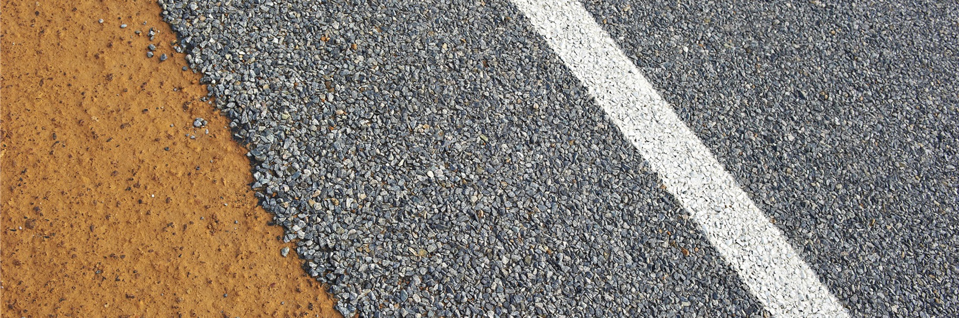 Close up of a regional road and dirt shoulder