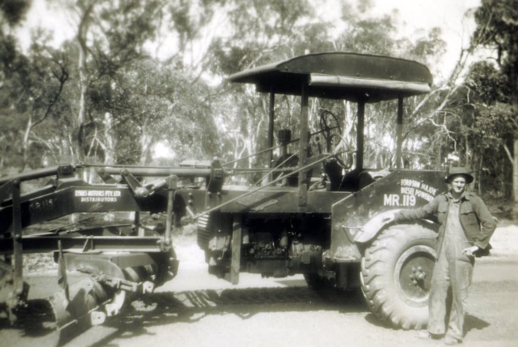 Operator Chris Miles alongside his Fordson Major Grader